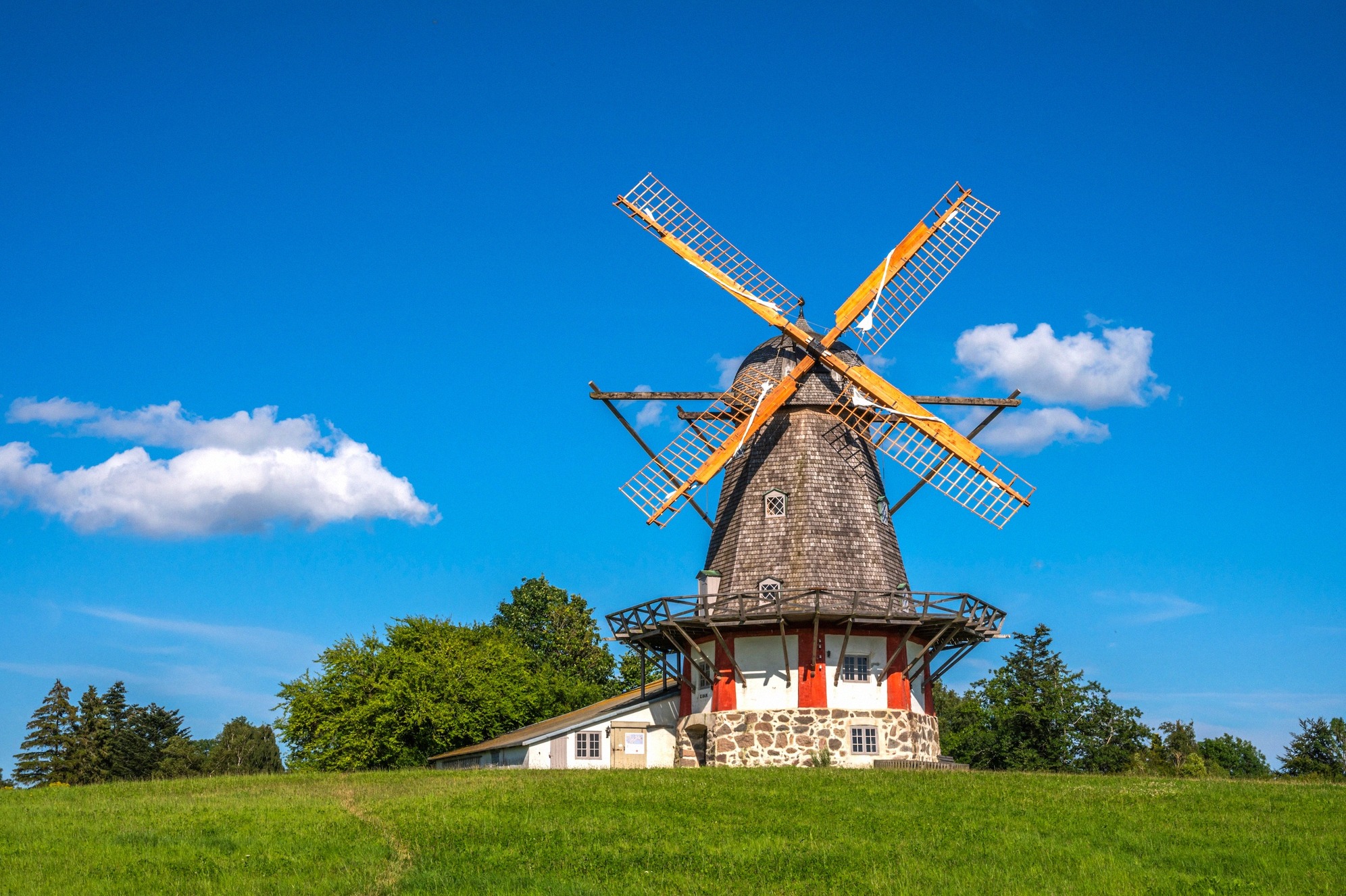 Bogø Mølle, the island's landmark windmill. The historic Bogø windmill with a red-and-white house
