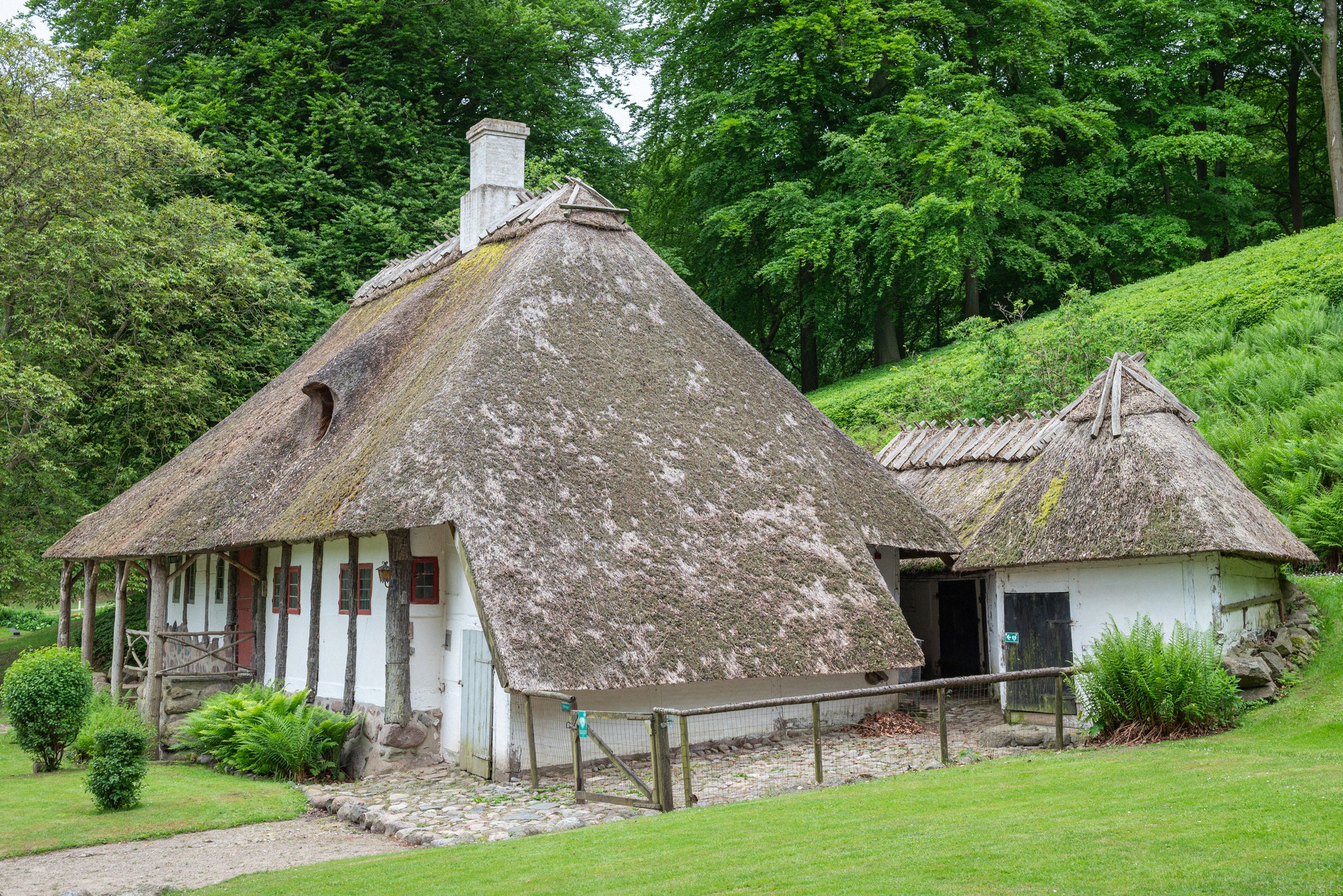 The thatched gardener's cottage, one of the park's ornamental follies. The thatched gardener's cottage in Liselund Park