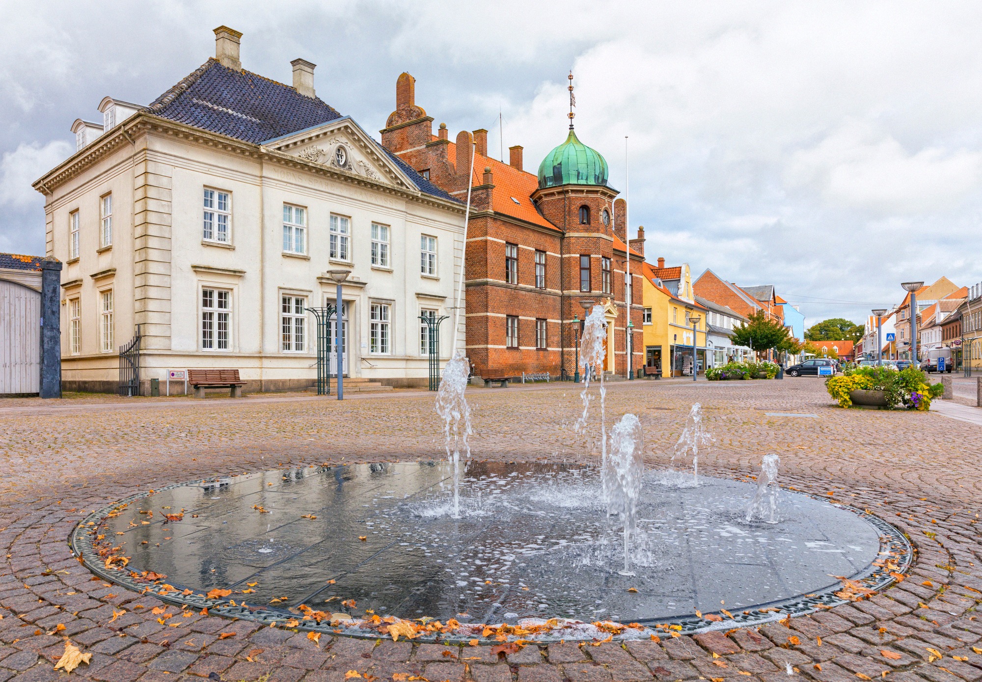 Stege's market square, the island's supply hub. Stege's market square with fountain and historic buildings